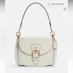 Stroll down Main St in this NWT, versatile authentic Coach bag!